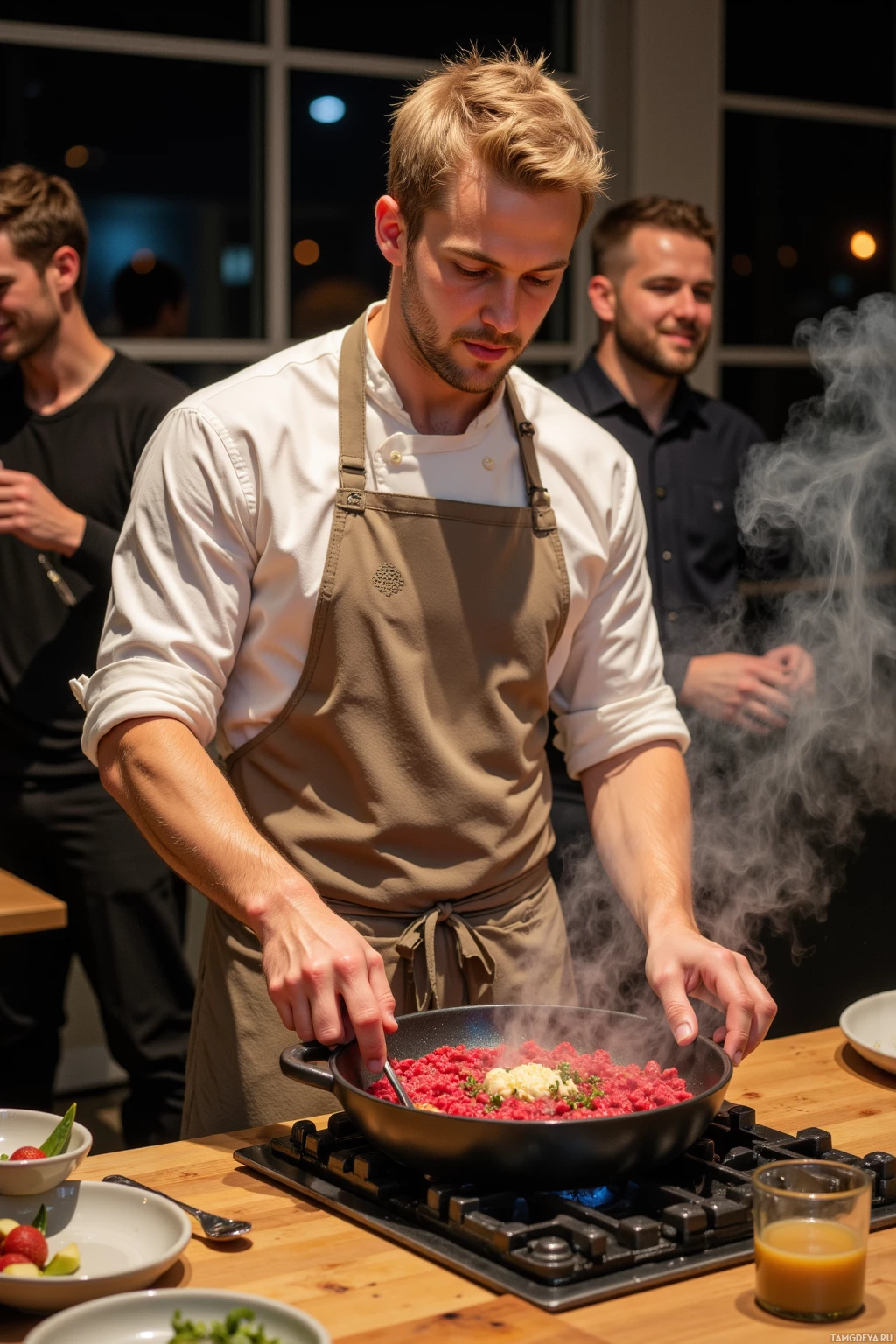A chef in an apron cooks a dish in a pan on a stove, with steam rising.